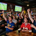Watch ดูบอลสด at an exciting sports bar filled with fans cheering for their teams.